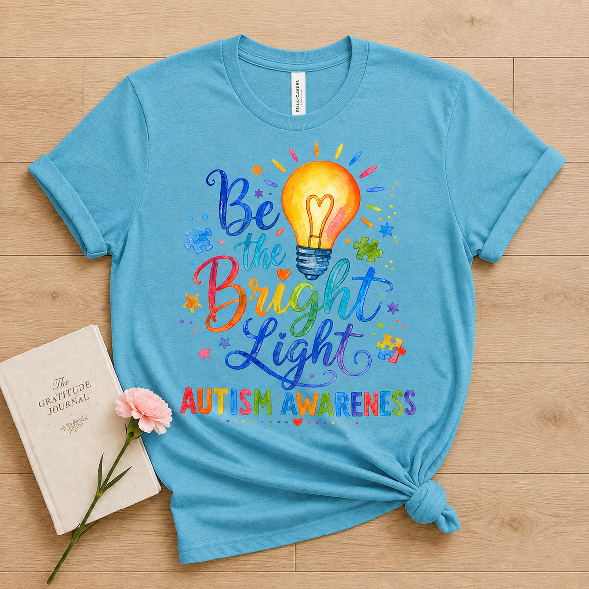 Unisex — "Be the Bright Light" Colorful Puzzle Tee
